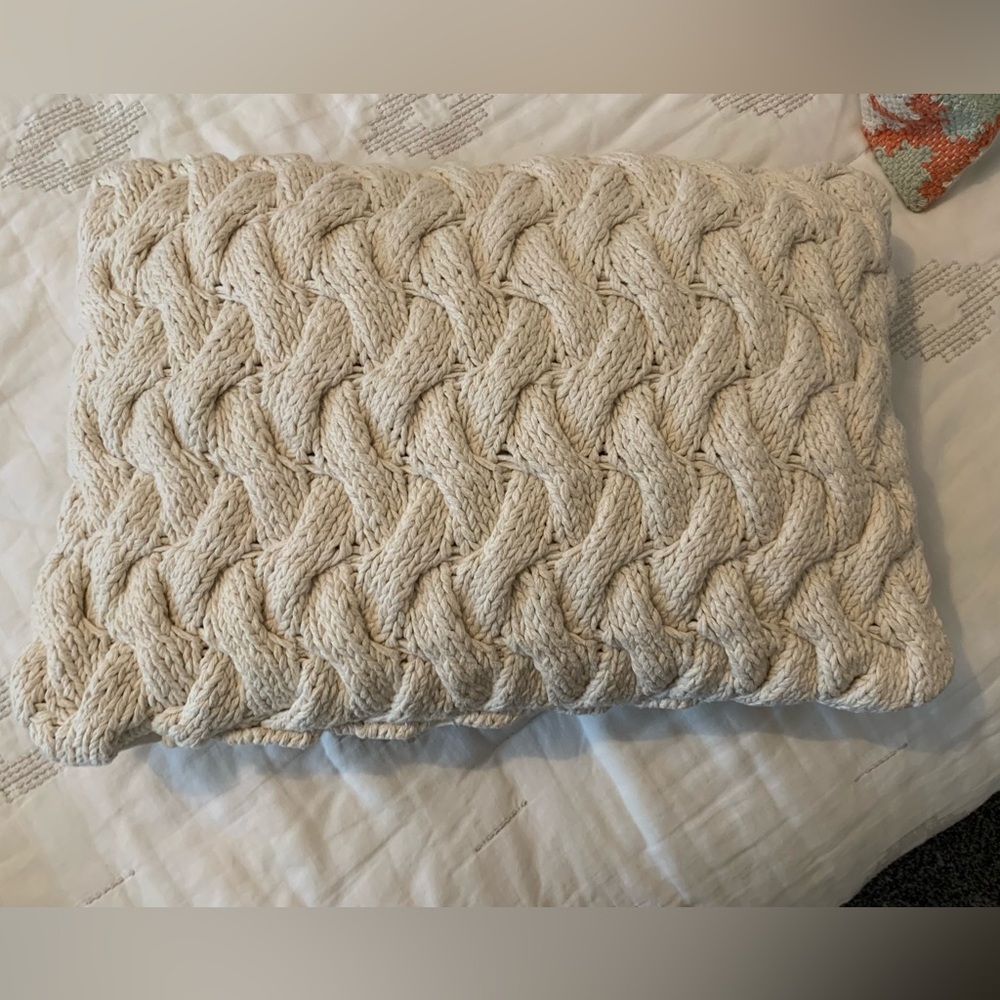 Cream colored knit decorative pillow